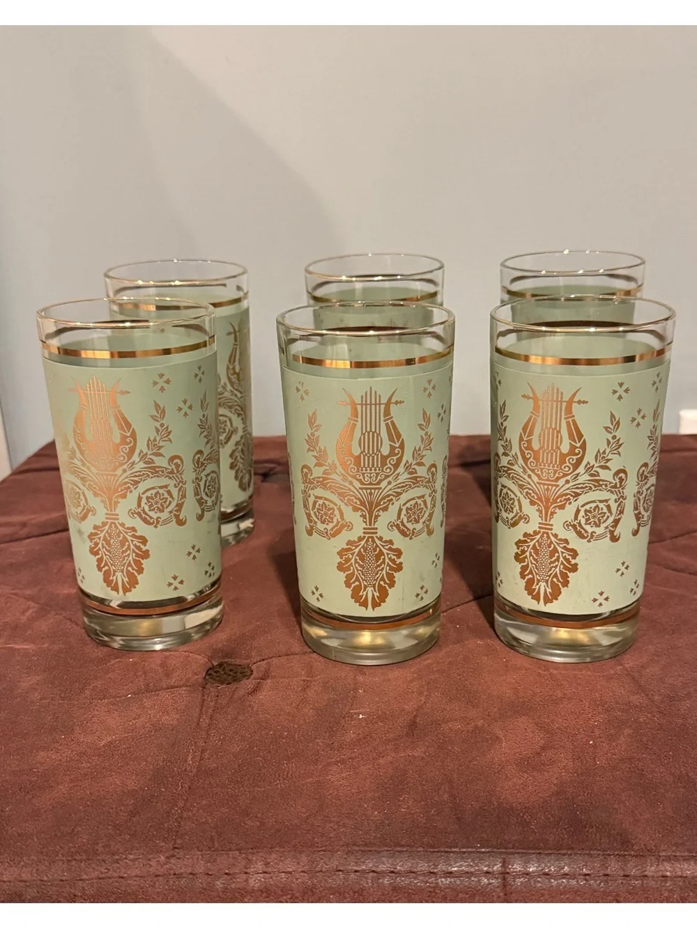 Set of 6 glasses vintage green and gold design. Holds 8 ounces